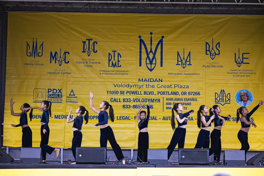 Asian dance group performing on stage at the Portland festival