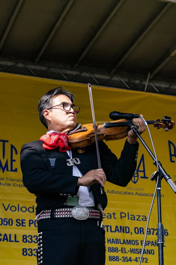 Mariachi violin performance at a Portland multicultural festival