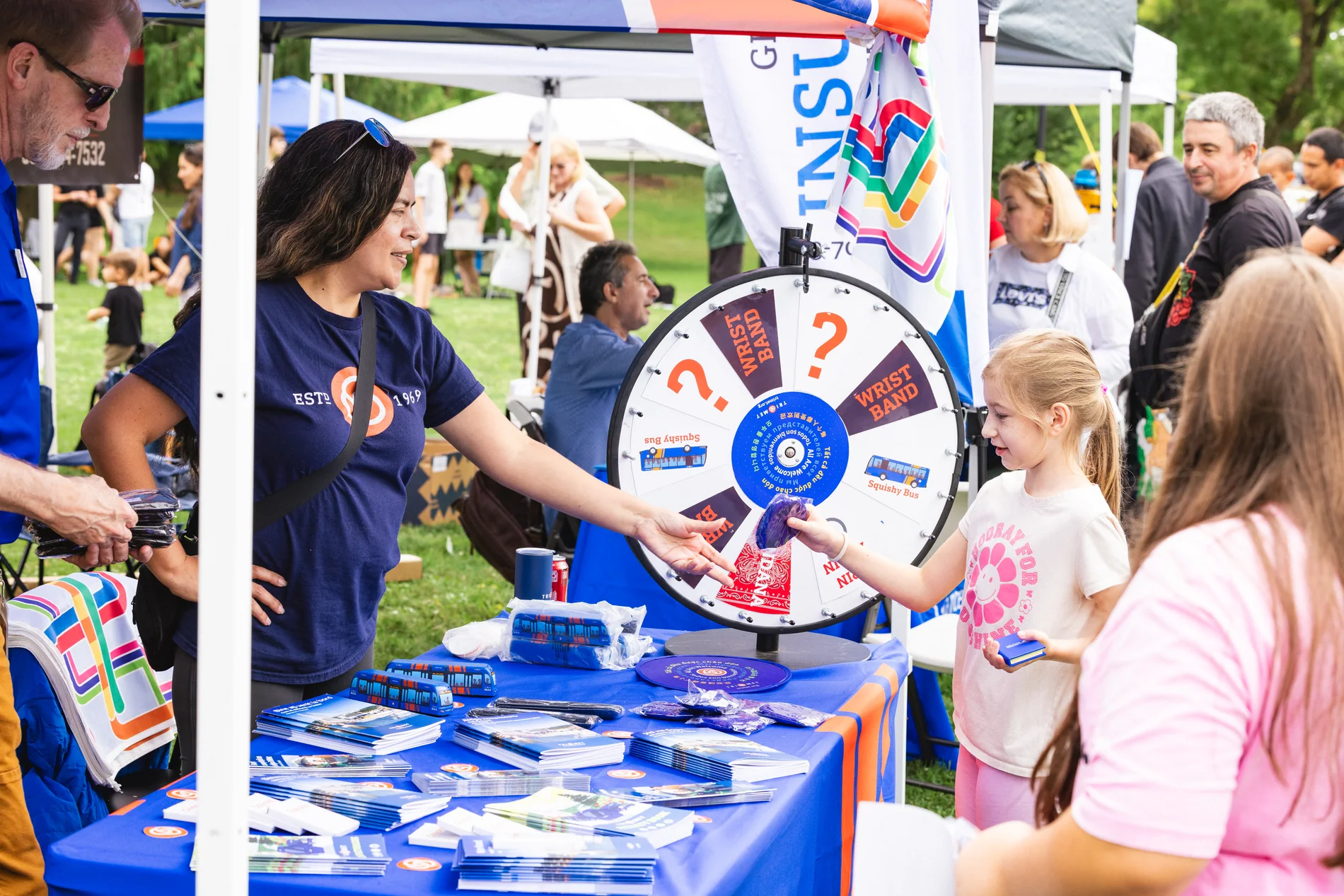 Vendor booth with prize wheel at the Multicultural Kids Festival in Portland